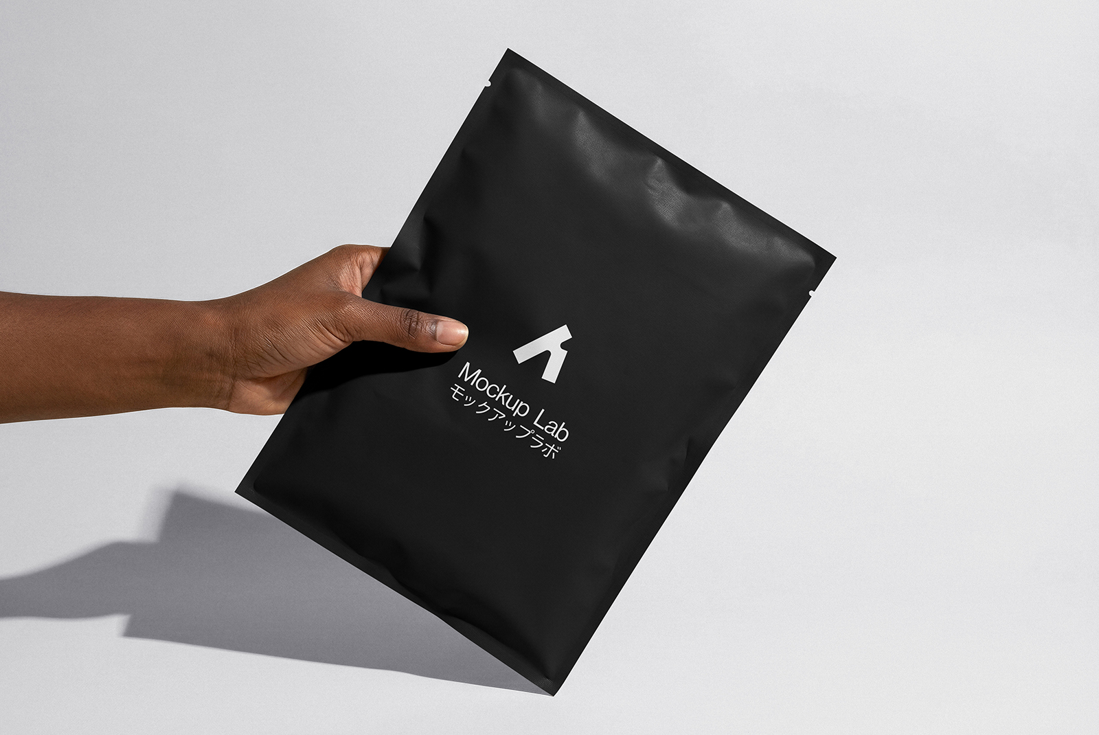 Angled perspective of the packet mockup, highlighting the subtle texture and print details.